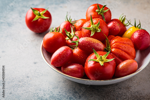 Fresh red and yellow tomatoes background.