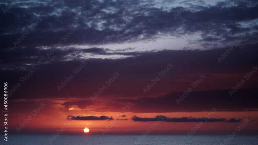 Seascape at early morning. Time lapse of dark stormy clouds moving over sea at sunrise. Nature landscape in Spain. Seascape at early morning. Time lapse of dark stormy clouds moving over sea at sunrise. Nature landscape in Spain.
