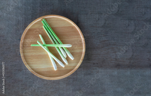 fresh lemongrass on a wooden tray