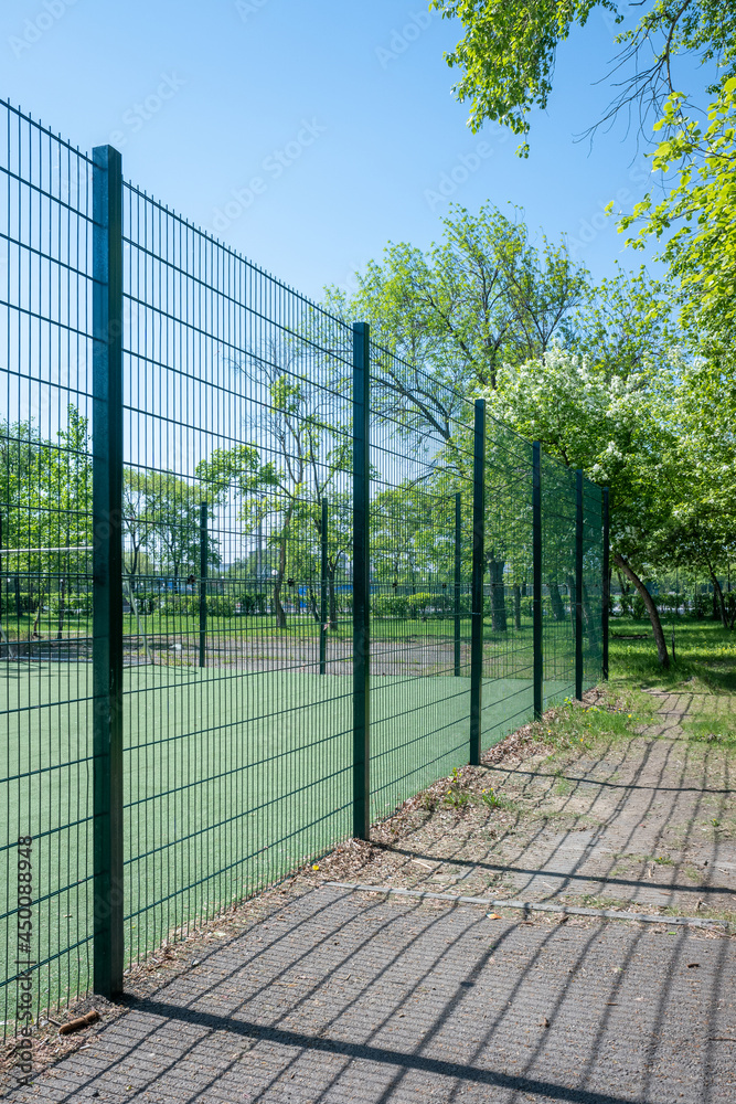Green fence between the football field. Green fence between the football field.
