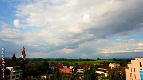 A time-lapse of the cloudy sky over Neuenkirch, Switzerland photo