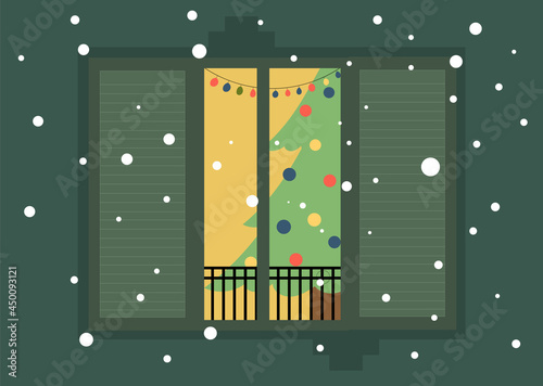 Christmas view, Christmas tree in the window, view of the window. A window in a house with a Christmas tree in the room. New Year's card