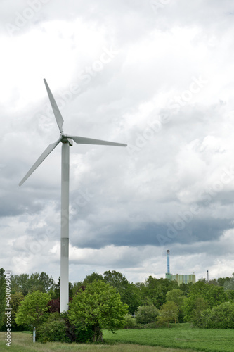 Karlsruhe, Maxau Germany: Wind turbine with thunderstorm sky and green landscape © EdLantis