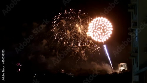 Fireworks painting the night sky in multiple bright colors during New Year's Eve 2019 at I.T. Park, Cebu City, Philippines.
