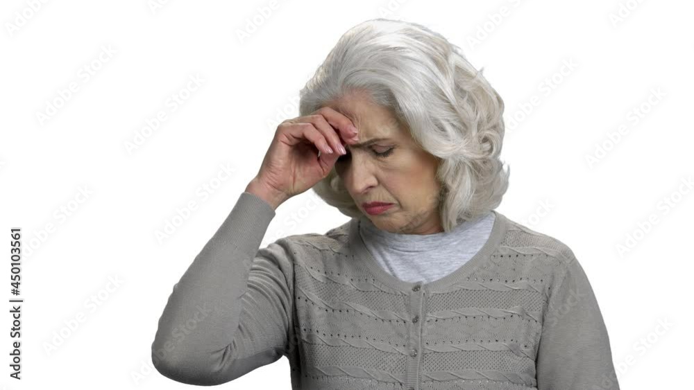 Portrait of upset mature woman on white background. Portrait of upset mature woman on white background.