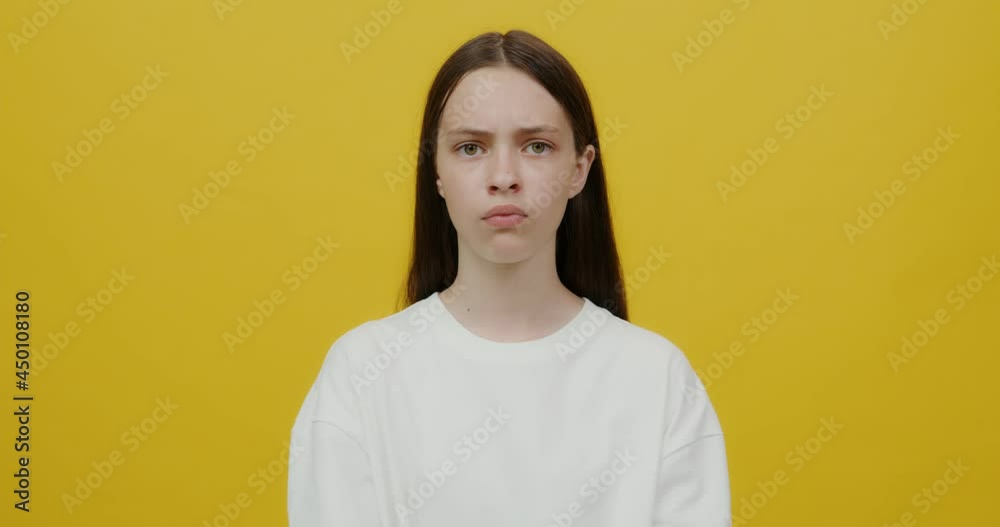 European young woman looks into the camera angrily, upset and offended European young woman looks into the camera angrily, upset and offended