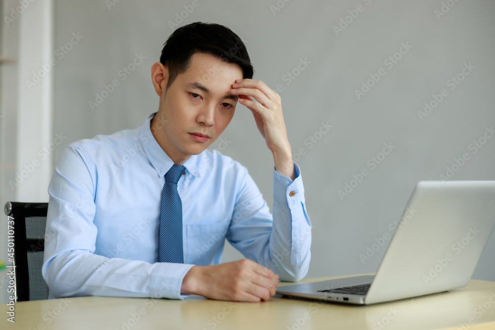 asian businessmann stressed for working project deadline in office asian businessmann stressed for working project deadline in office