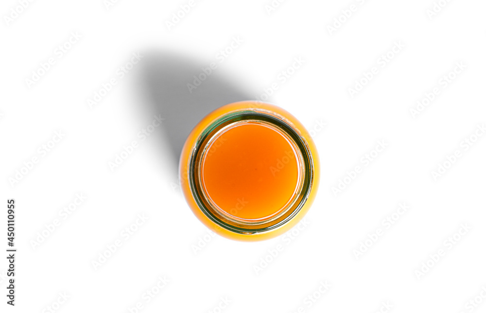 Orange juice in bottle isolated on a white background.