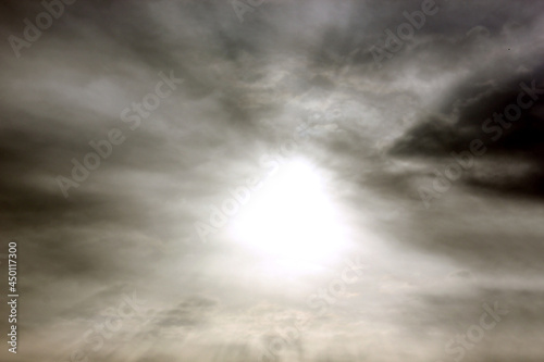 Grey sky. Sunlight. Clouds are floating across the sky. Backgrounds. Space to copy