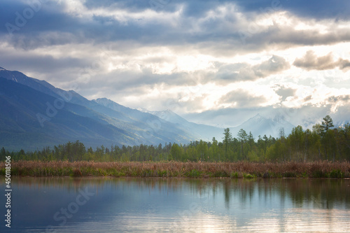 Landscape with mountains reflecting in the water. Buryatia, Tunkinskaya valley