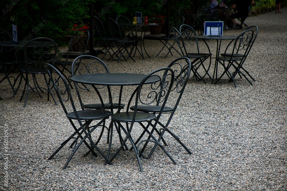 iron tables in a bar outside on Lake Maggiore, in Italy