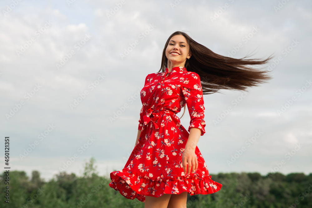 portrait of a beautiful young woman in summer 