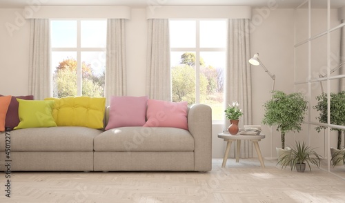 Stylish room in white color with sofa and autumn landscape in window. Scandinavian interior design. 3D illustration © AntonSh