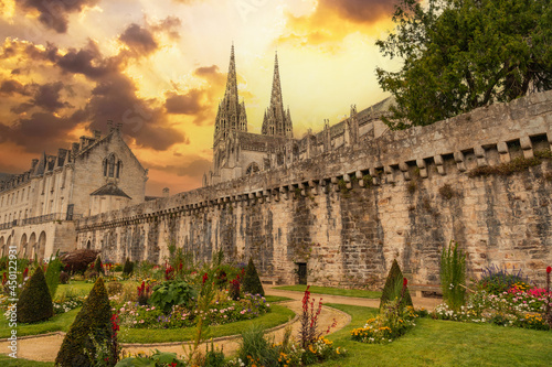 Sunset on the walls of the medieval town of Quimper and the cathedral of Saint Corentin, department of Finisterre. French Brittany, France photo