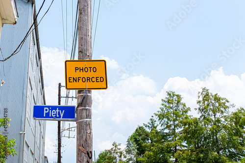 Fotografie Photo Enforced Piety Sign on Utility Pole