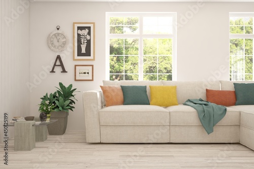 Stylish room in white color with sofa and summer landscape in window. Scandinavian interior design. 3D illustration