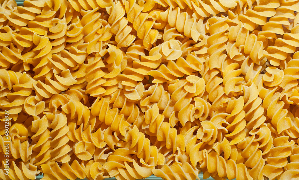 Pasta texture. Many yellow pasta are piled on the pile. Pasta texture. Many yellow pasta are piled on the pile.