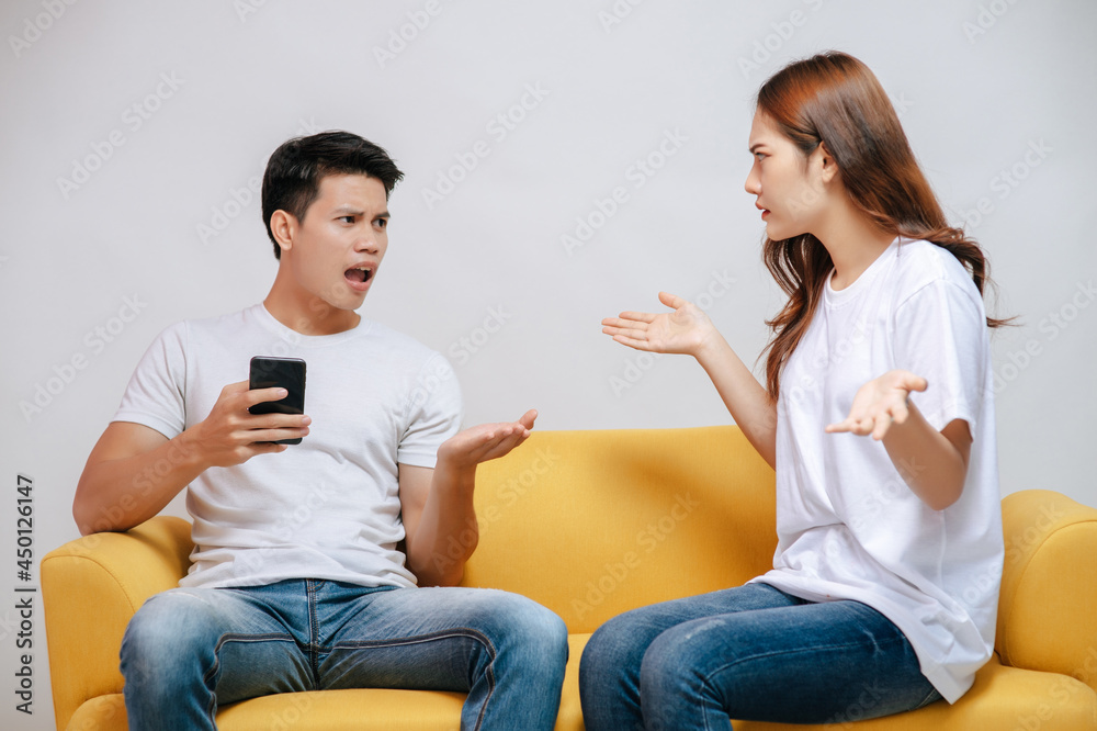 Young man addict on mobile phone and ignoring pretty girl