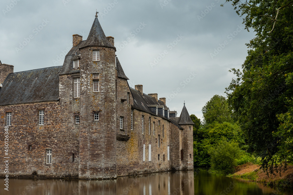 The medieval Chateau Trecesson by the lake, commune of Campénéac in the Morbihan department, near the Broceliande forest. The medieval Chateau Trecesson by the lake, commune of Campénéac in the Morbihan department, near the Broceliande forest.