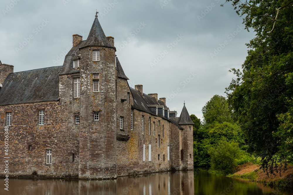 The medieval Chateau Trecesson by the lake, commune of Campénéac in the Morbihan department, near the Broceliande forest.