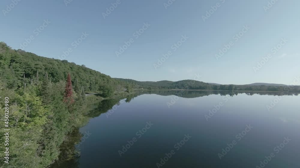 Aerial flight along lake road in the morning Aerial flight along lake road in the morning