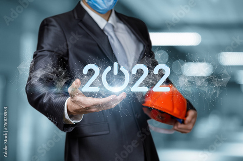 Civil engineer shows the new year 2022 . photo