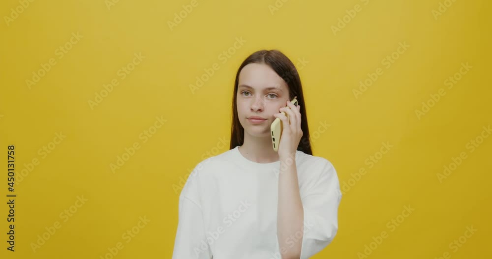 European young woman experiences different feelings when speaking on a mobile European young woman experiences different feelings when speaking on a mobile