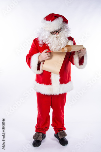 Funny Santa Claus with a list of gifts.