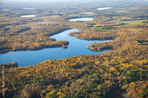 Fototapeta Naklejka Na Ścianę i Meble -  Aerial view of lakes and forest in autumn color near Brainerd, Minnesota