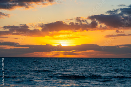 Dramatic sky colors as the sunset over the ocean in Florida