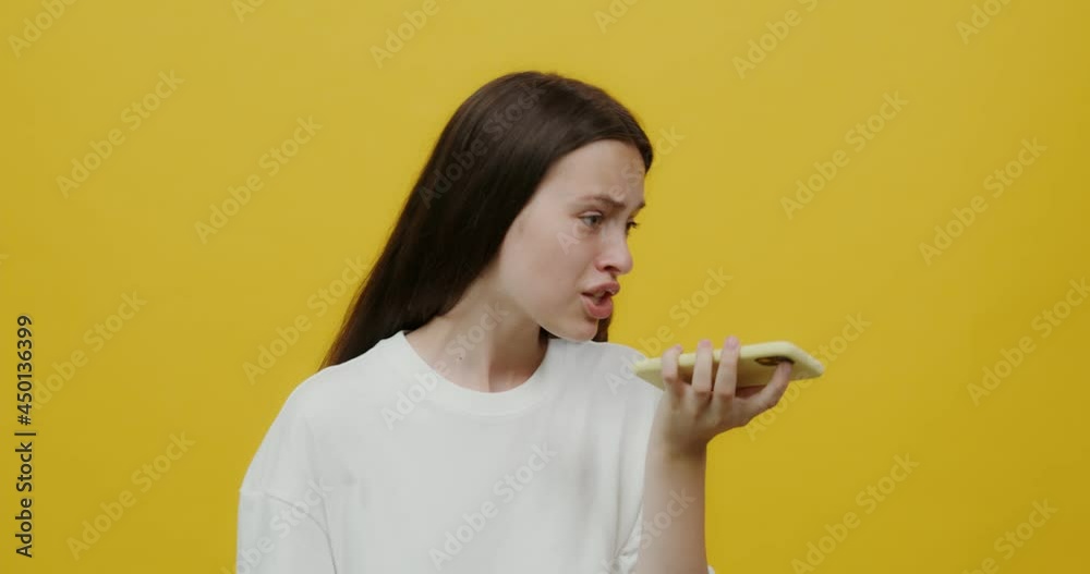 European woman, angry and upset, shouts into a mobile phone. European woman, angry and upset, shouts into a mobile phone.