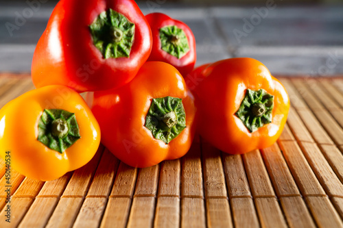 Quadro su tela High angle shot of red and yellow bell peppers on a drying mat
