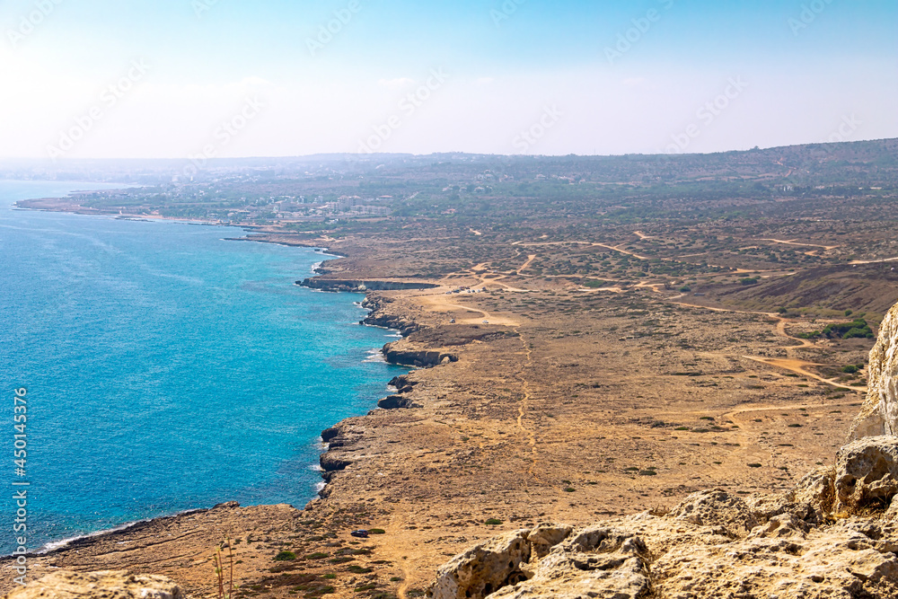View from cape Capo Greco on the island of Cyprus. Mediterranean sea with fog in the distance. National Forest Park is located between the resort towns of Ayia Napa and Protaras. 