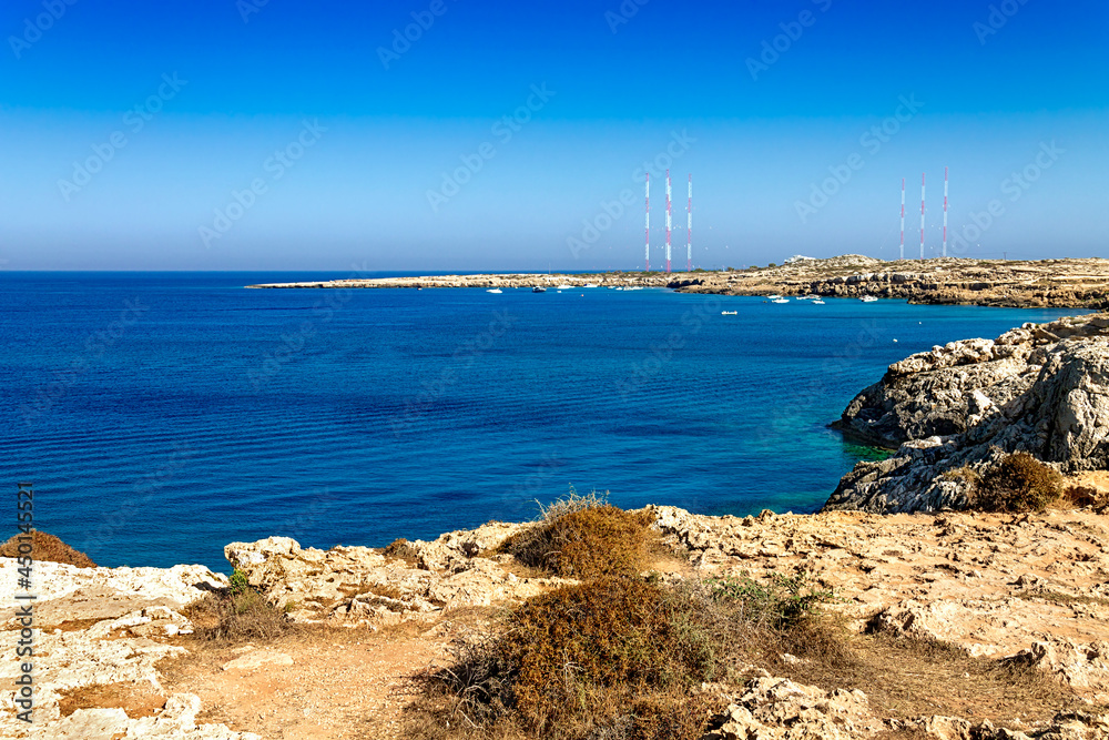 View of the blue lagoon. A popular place in the Cape Greco National Forest Park on the island of Cyprus. Mediterranean landscape. View of the blue lagoon. A popular place in the Cape Greco National Forest Park on the island of Cyprus. Mediterranean landscape.