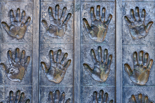 Metal open hands in sculpture in the Plaza de la Catedral de Leon. Spain 