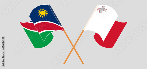 Crossed and waving flags of Namibia and Malta