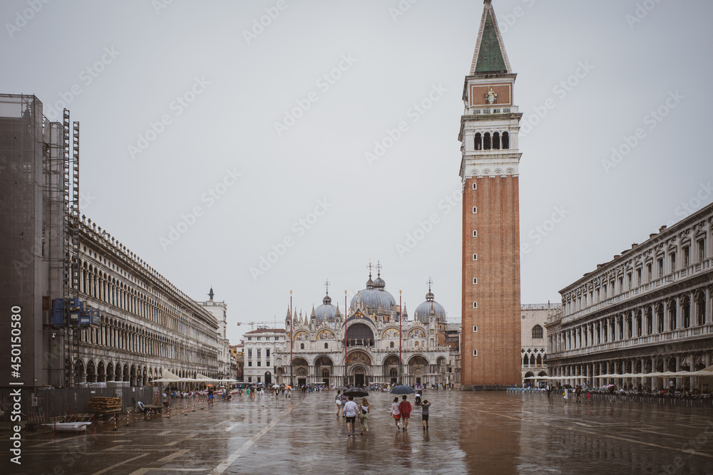 Venice's marcus square in rain is almost deserted