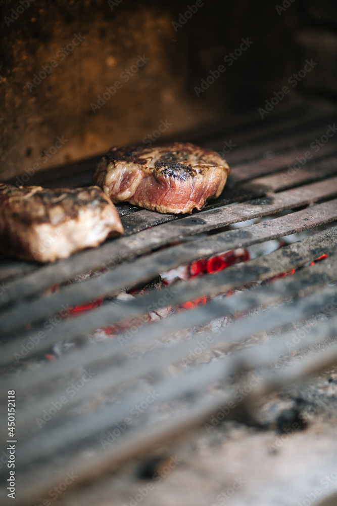 Fototapeta premium Steaks on barbecue