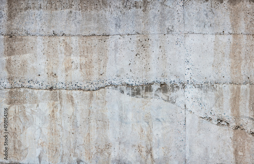 Concrete sunny wall with drips