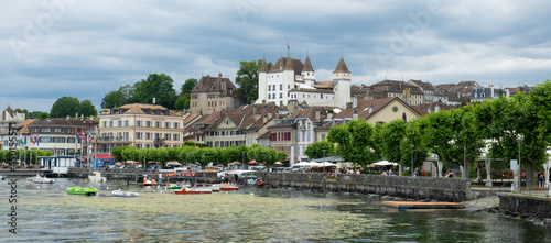 Nyon, Switzerland - July 10th 2021: View of the waterfront of the city at Lac Leman photo