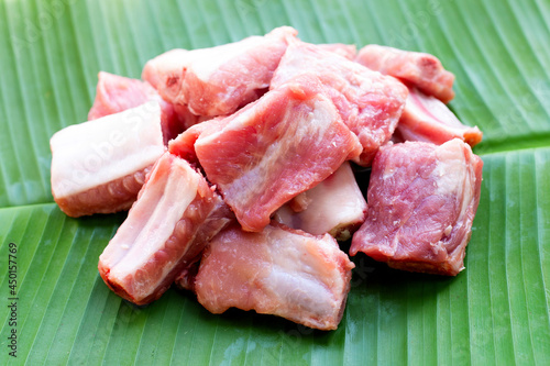 Raw pork ribs on banana leaf