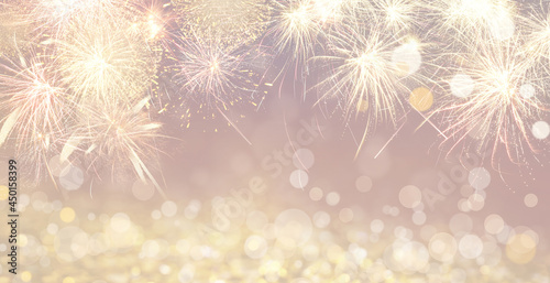 Abstract festive background with fireworks  bokeh effect. New Year celebration