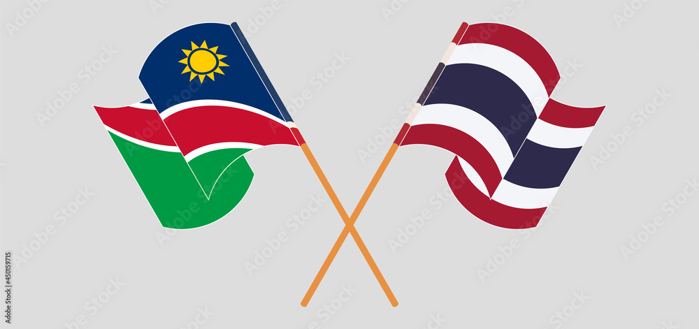 Crossed and waving flags of Namibia and Thailand