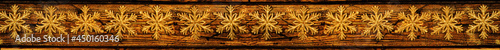 Christmas banner in a rustic style, golden snowflakes on a wooden background of horizontal boards, table, top view