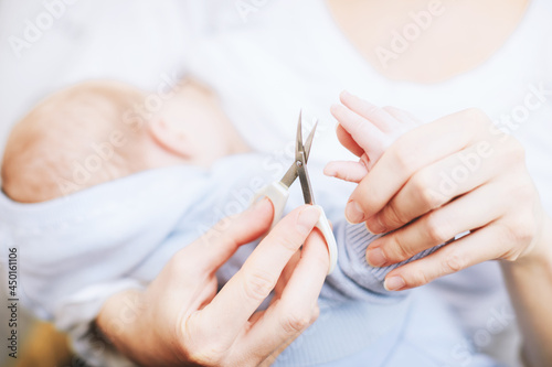 mom cuts her baby s nails