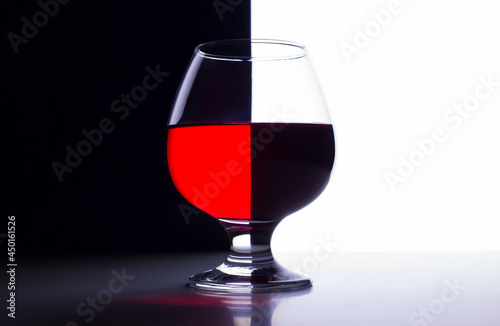 A glass of wine on an abstract background with a tilt effect.