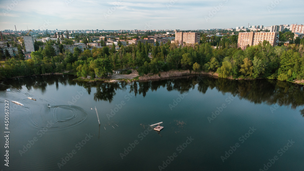Aerial panoramic view on Wake Park recreation area on summer lake Komsomolske Ozero in Kharkiv, Ukraine