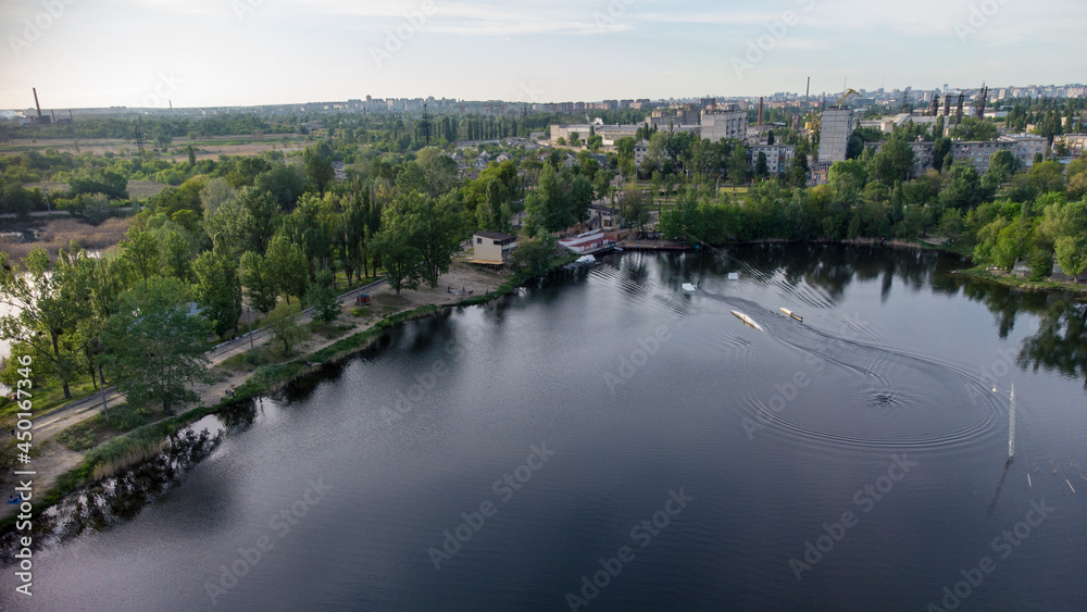 Aerial panoramic view on Wake Park recreation area on lake Komsomolske Ozero in Kharkiv, Ukraine. Wakeboarding water sports