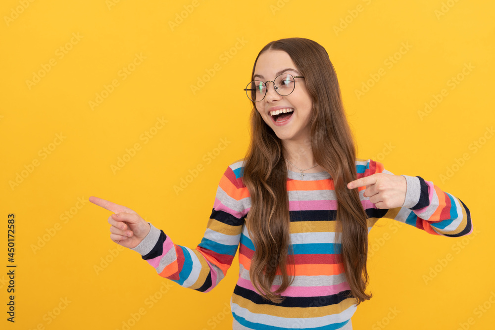 happy smart kid. teen girl in eyeglasses pointing fingers. vision acuity. eyesight. happy smart kid. teen girl in eyeglasses pointing fingers. vision acuity. eyesight.