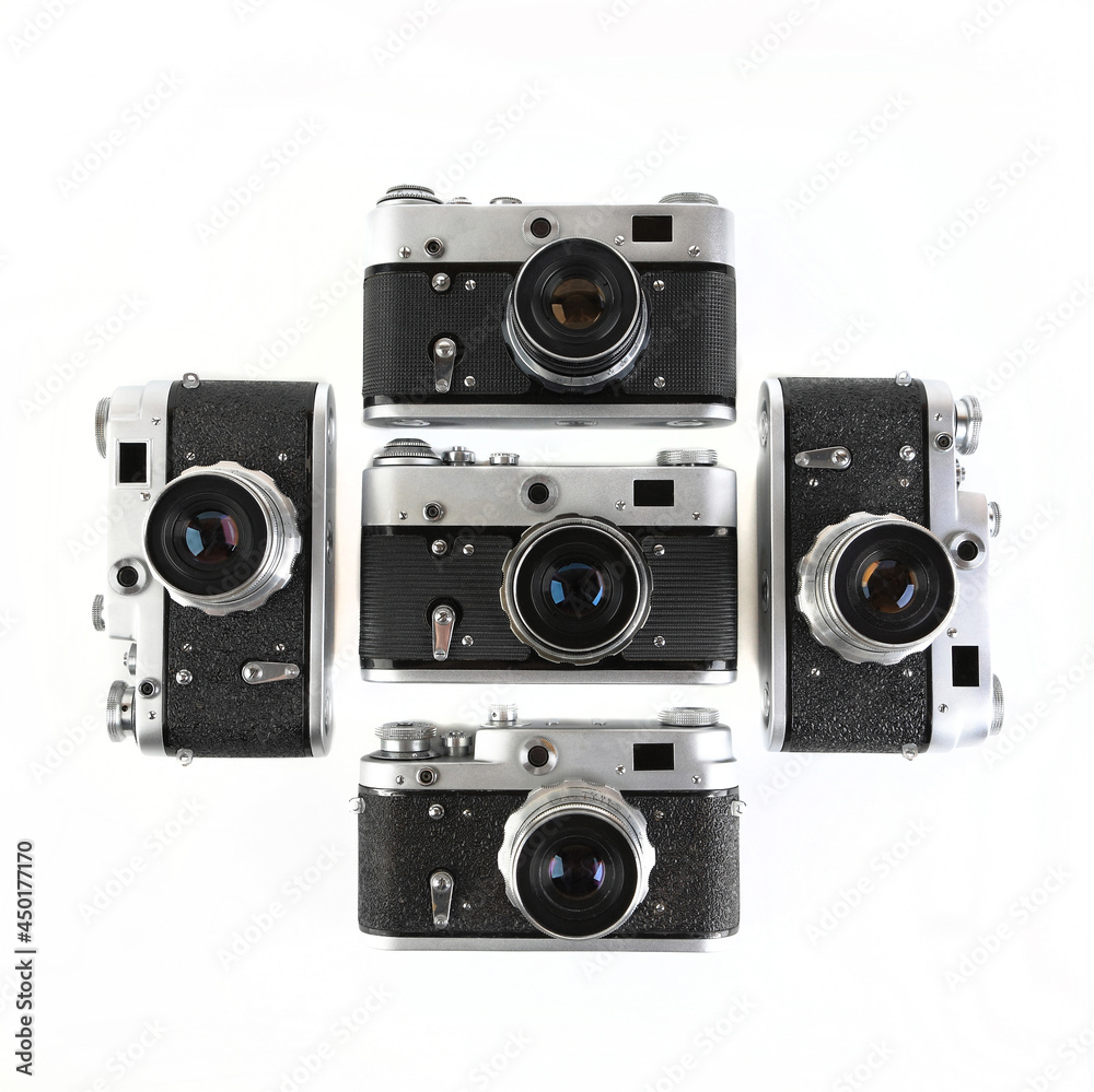 Fototapeta premium The old 35 mm film rangefinder cameras on white background.